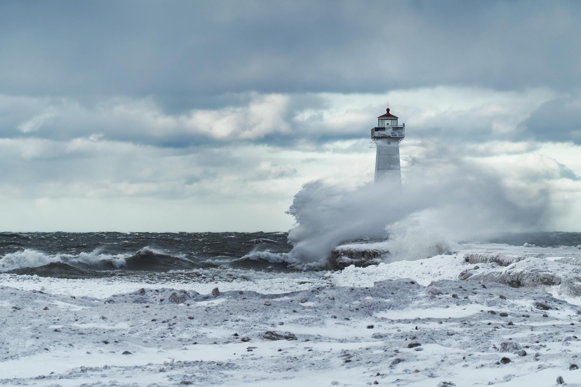 winter waves crashing at sodus point lighthouse